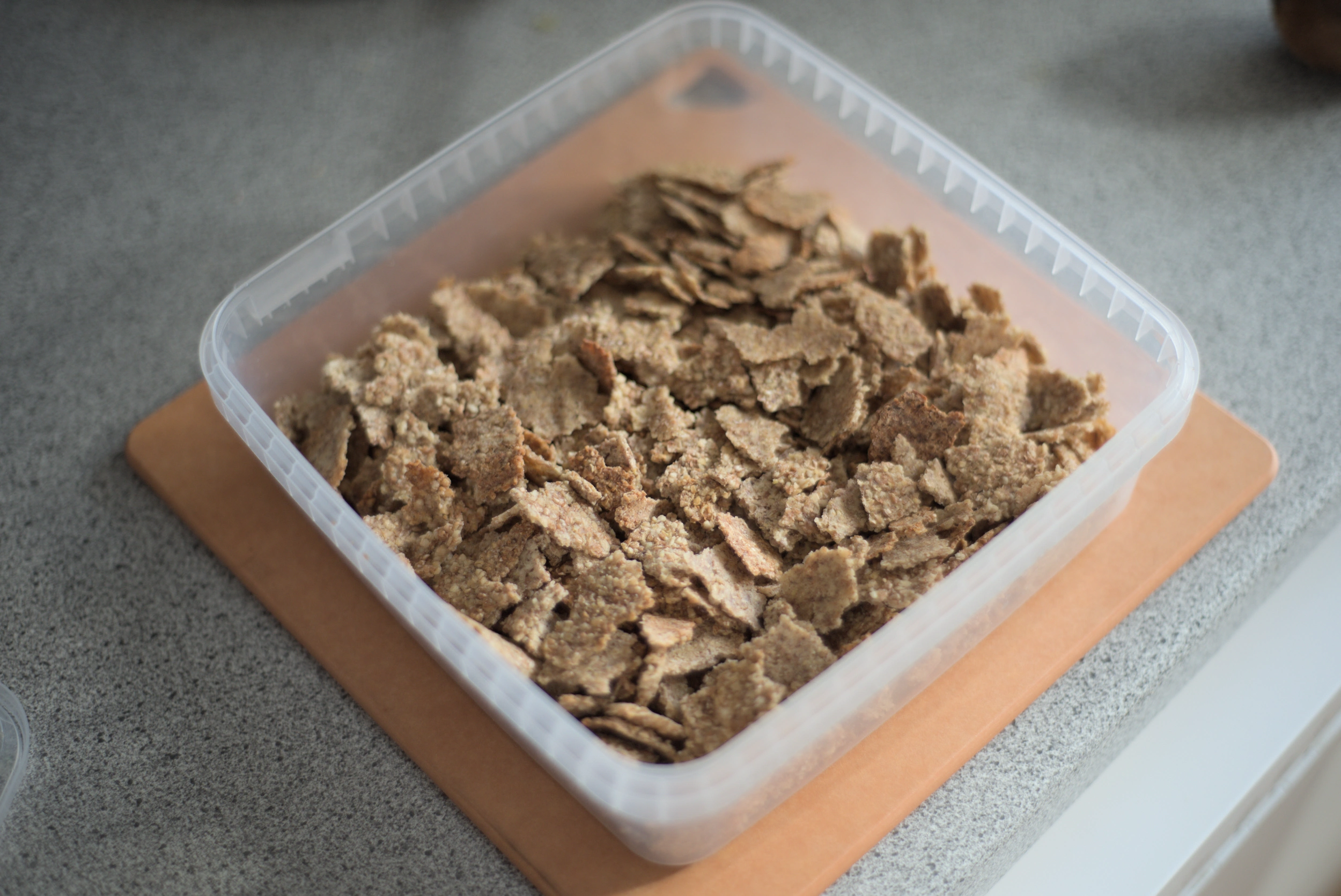 Homemade bran flakes in a container